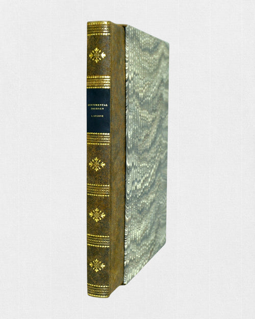 Kolekcjonerskie wydanie „A Sentimental Journey Through France and Italy” Laurence’a Sterne’a w ręcznej półskórkowej oprawie z marmurkowymi okładzinami i złoconym grzbietem.