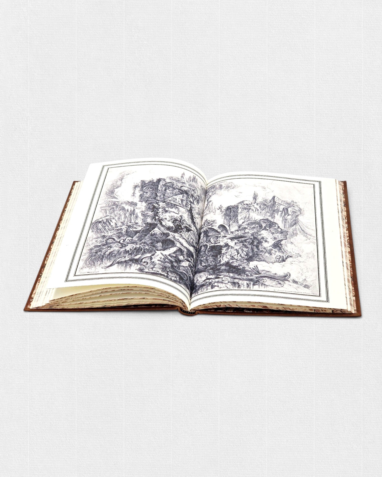 Otwarte kolekcjonerskie wydanie „Żywotu Nerona” Swetoniusza przygotowane przez Rambler Press. Widoczne ilustracje ruin starożytnego Rzymu według Giovanniego Battisty Piranesiego, druk na papierze Fabriano Tiepolo oraz klasyczna oprawa bibliofilska inspirowana dawną sztuką książki.